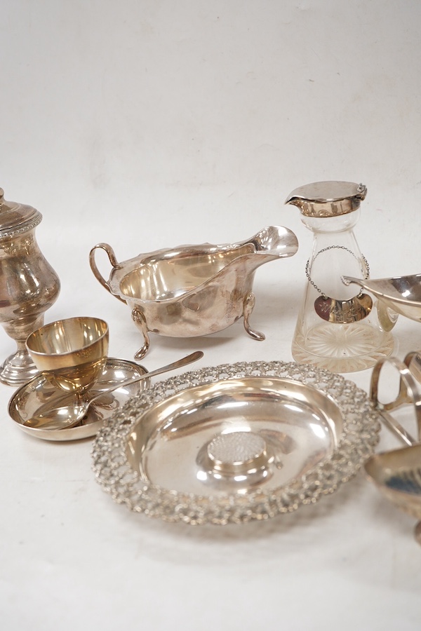 A group of assorted small silver including an Elizabeth II small circular dish by Stuart Devlin, London, 1985, diameter 13.5cm, a sauceboat, a 1920's seven bar toastrack, two pedestal salts including late Victorian, an e